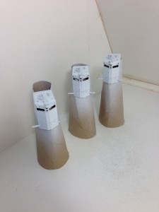 Toilet Paper Tubes make for good handles and stands for painting